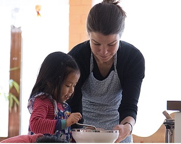 Child and Adult working in kitchen