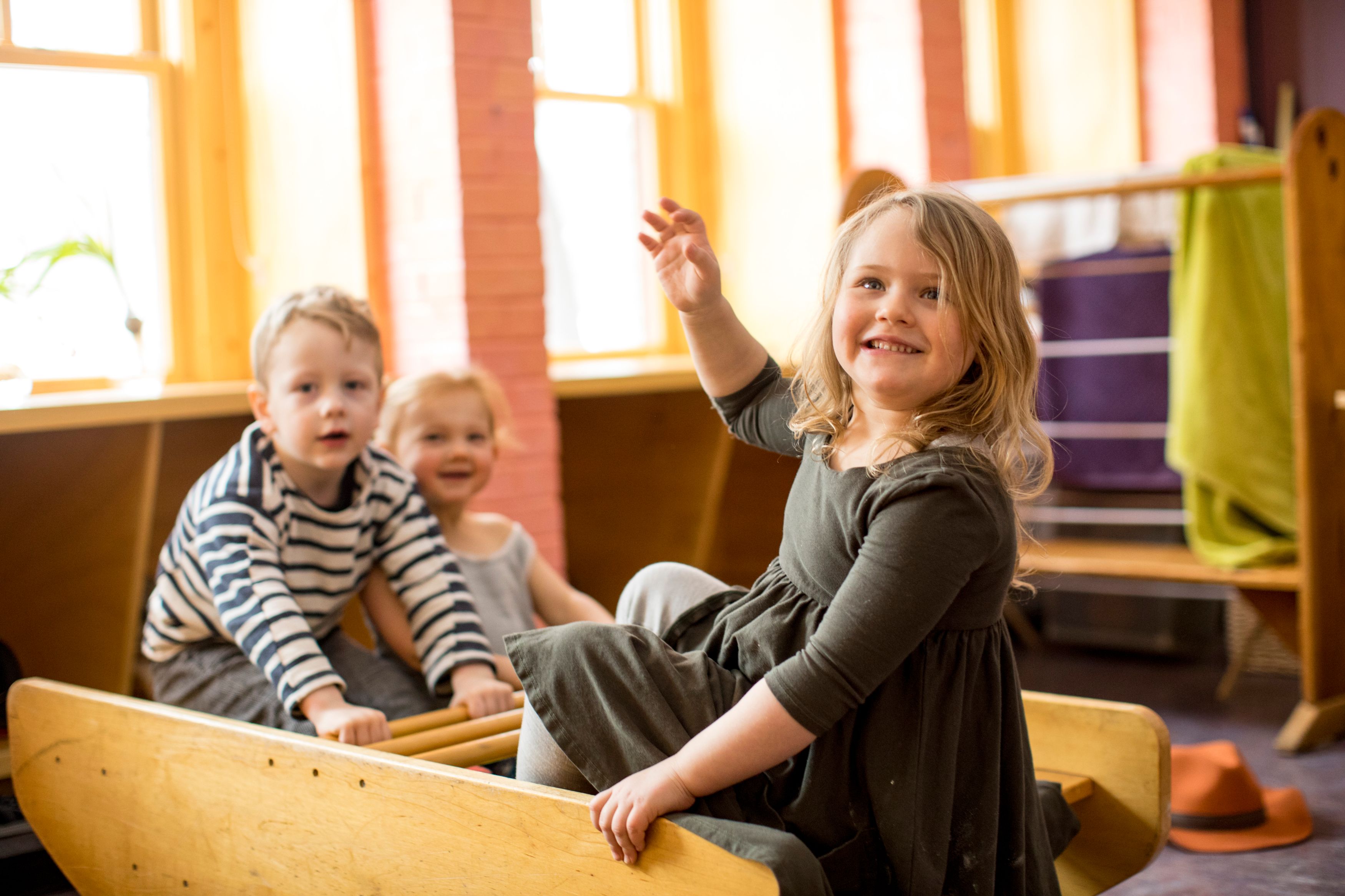 Group of children in rocking toy