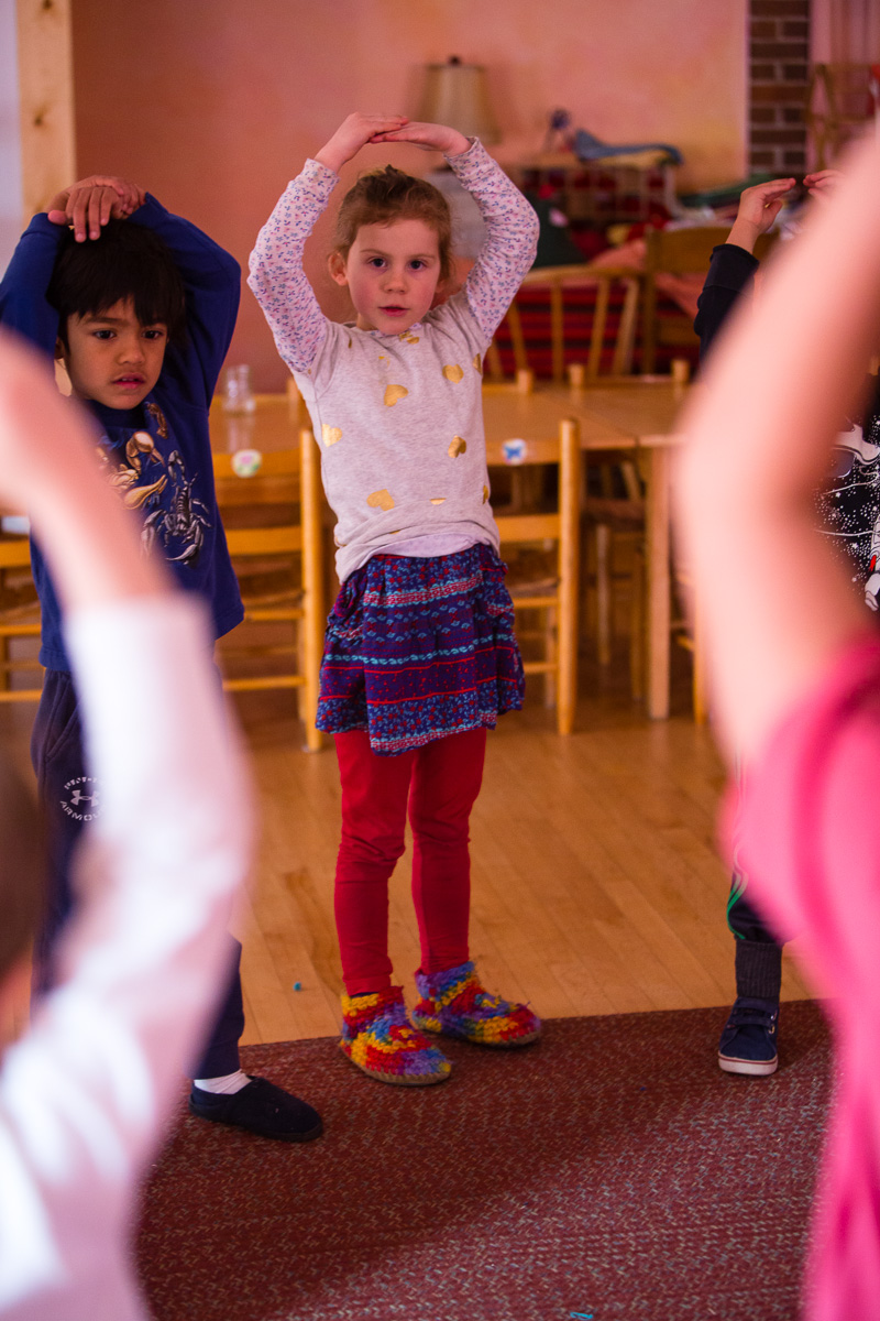 Smiling girl with arms overhead