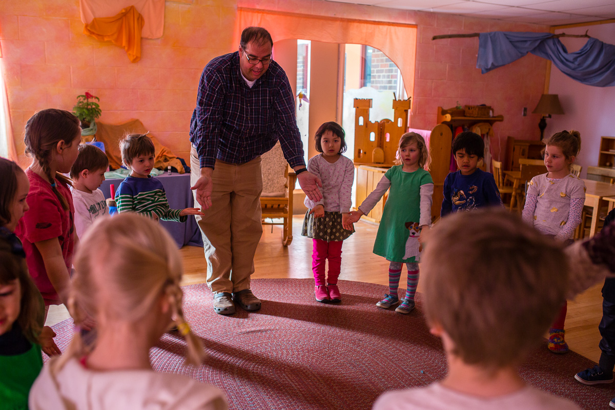 Students in circle with teacher