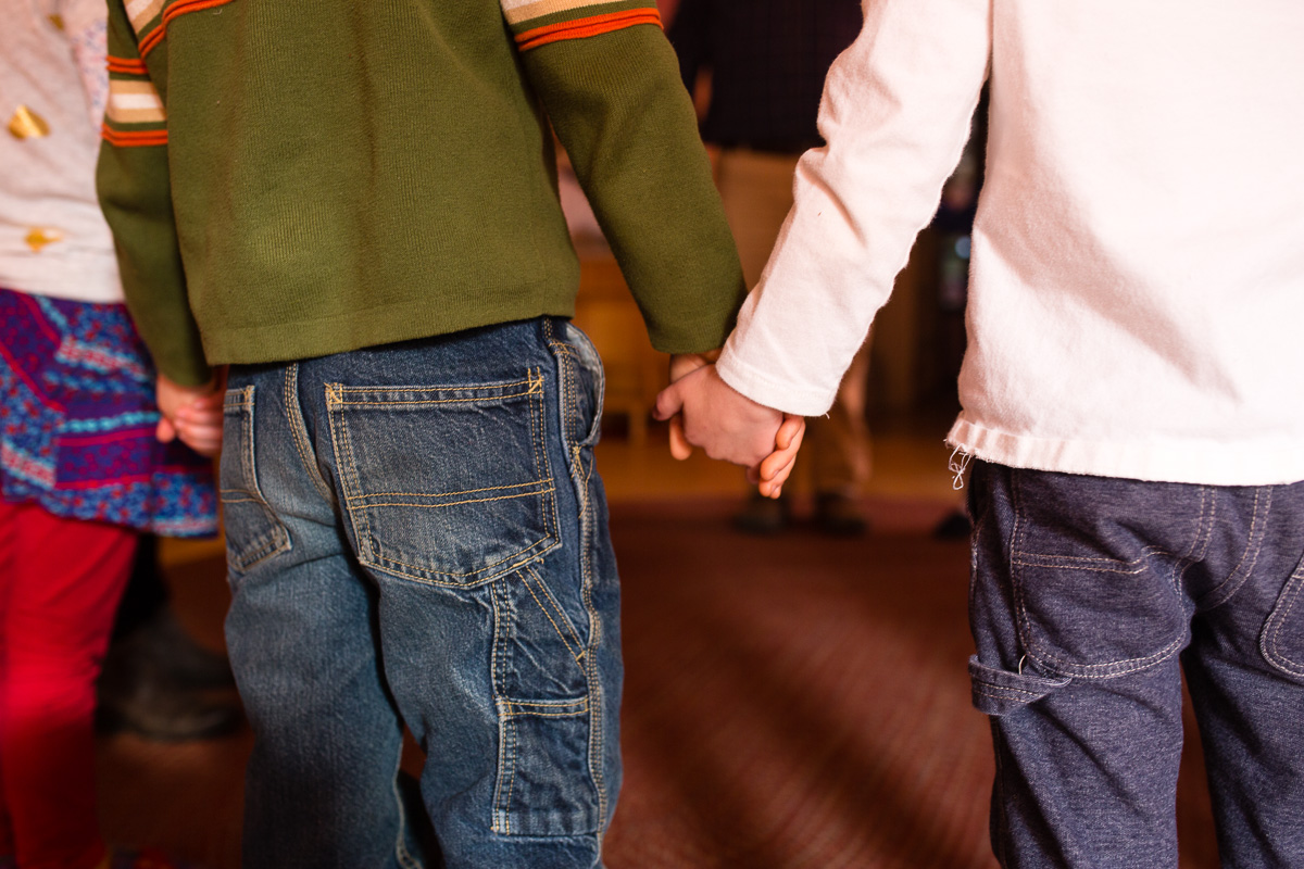 Young children holding hands