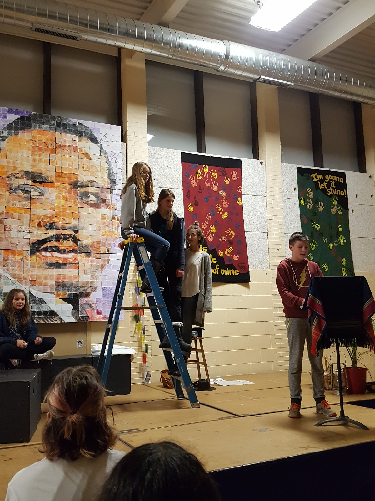 Students Presenting with MLK Mosaic in Background