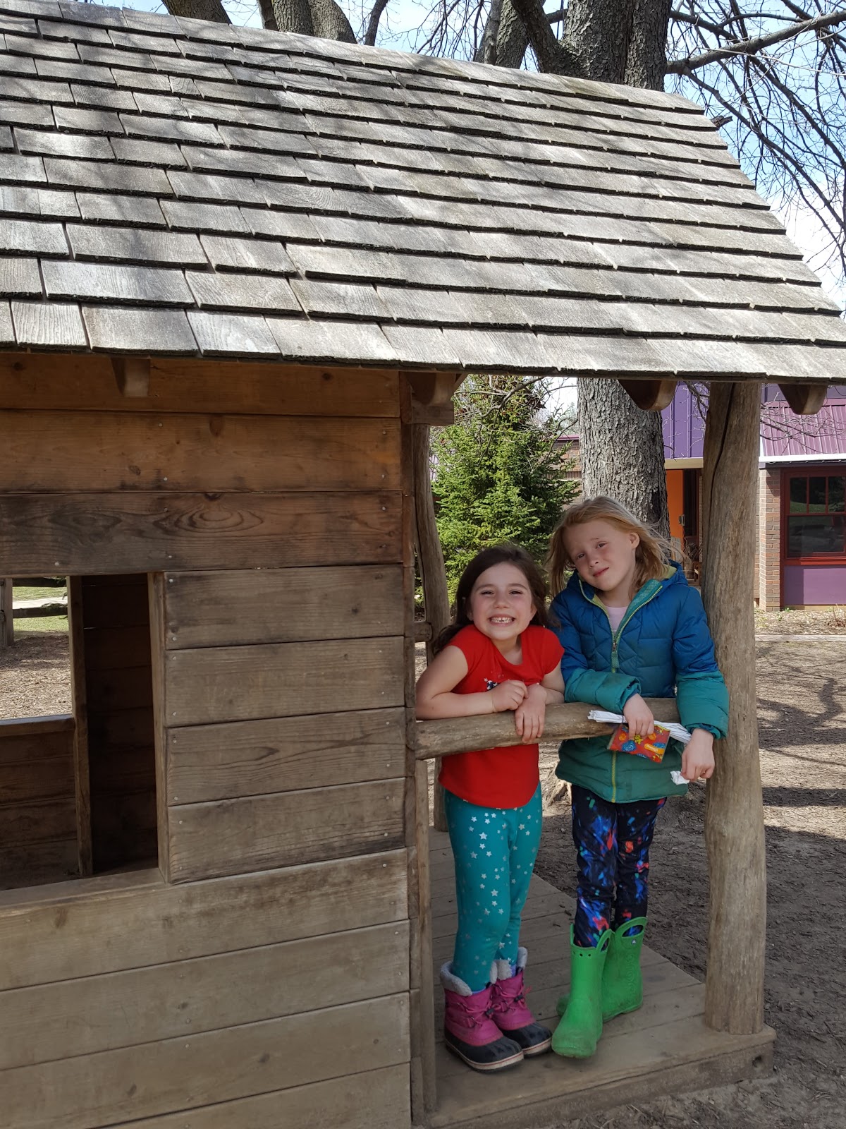 Two girls in playhouse