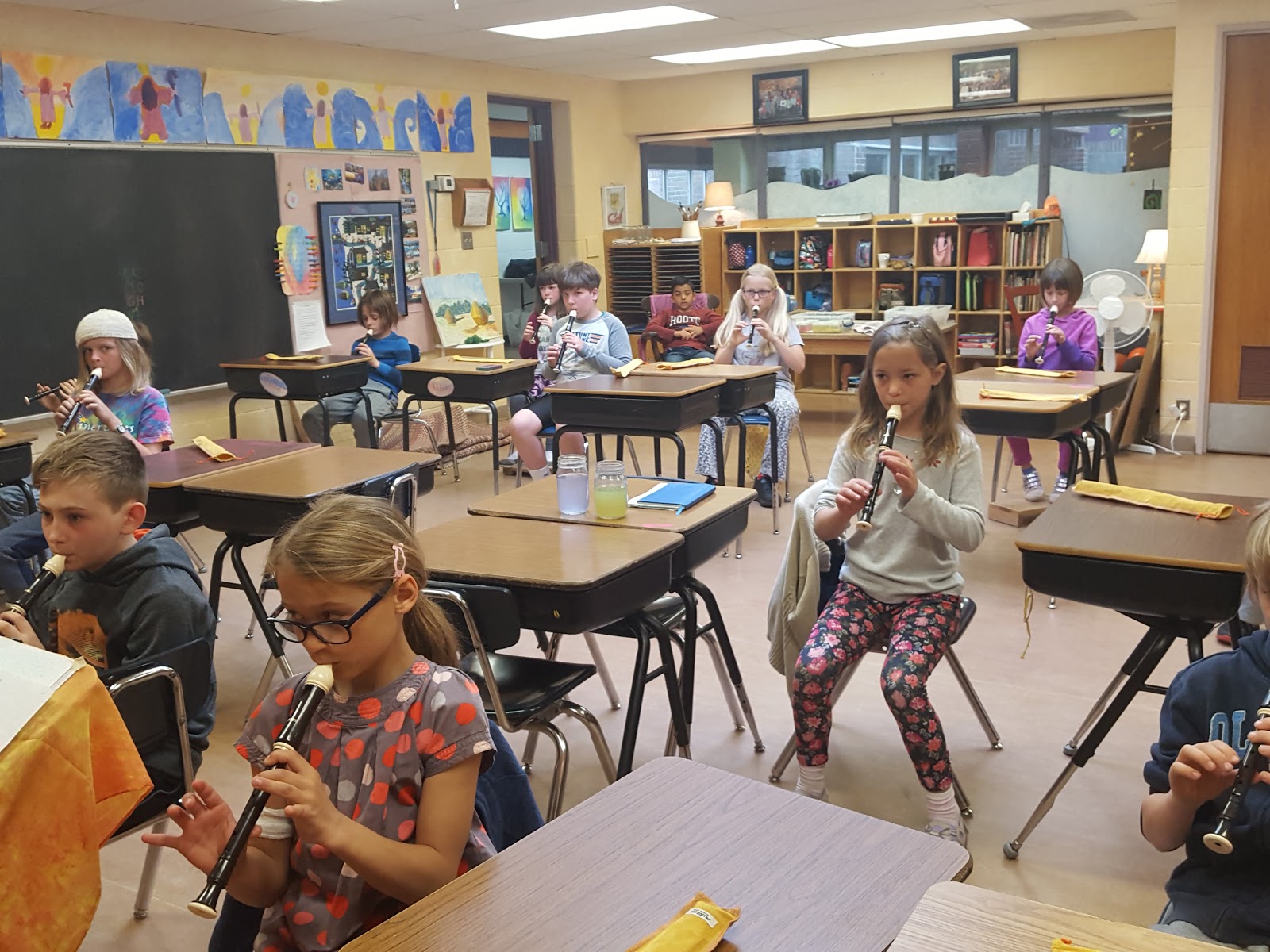 Second grade class playing recorder