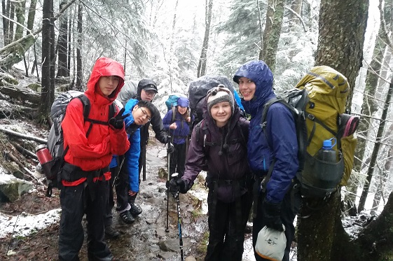 Group of students hiking in snow