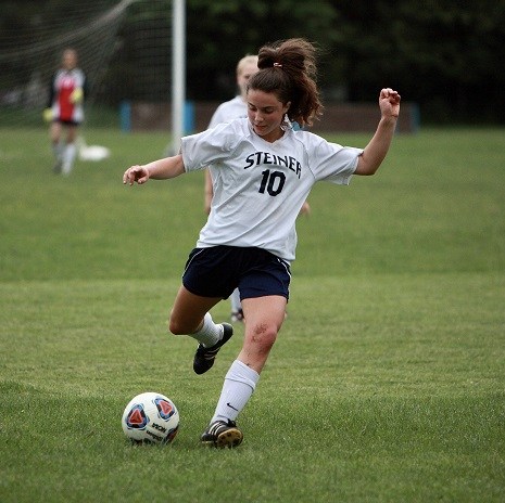 Girl Kicking Soccer Ball