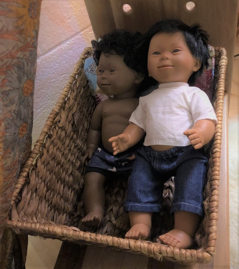 Two Dolls in Cradle